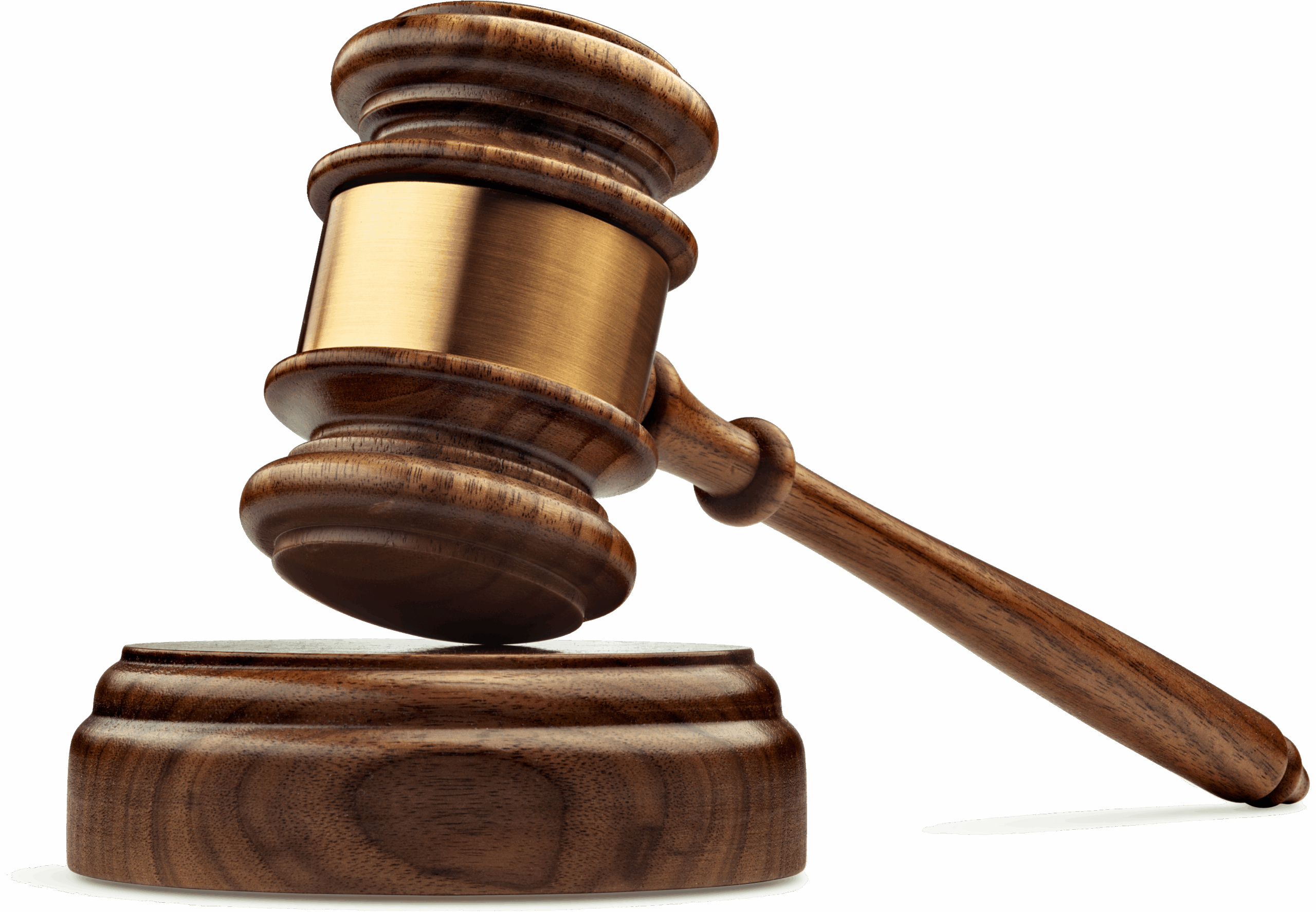 Wooden gavel poised to strike a sounding block, symbolizing authority and justice in a courtroom setting.